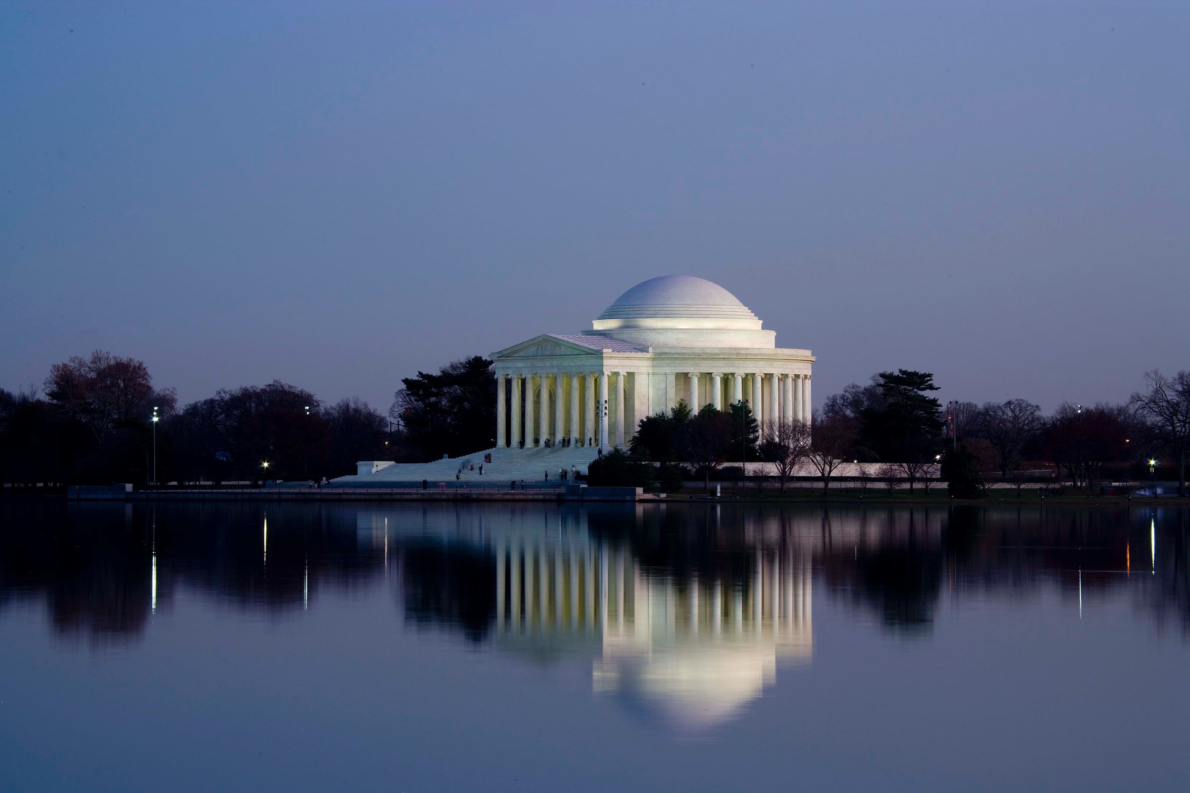 The Thomas Jefferson Memorial at dusk, reflected in the Tidal Basin